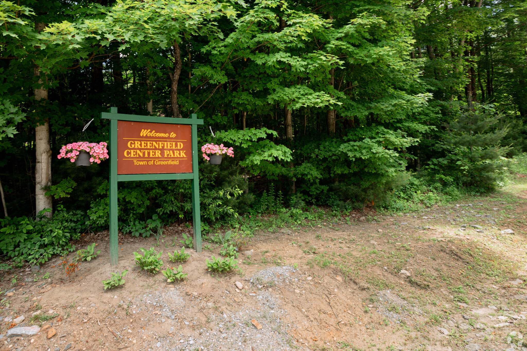 The sign for Greenfield Center Park
is secluded and off the street.