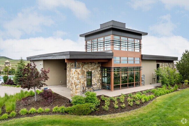 The Lantern House in Stepping Stone serves as a central hub for community activities, complete with a pool, fire pit, and gathering spaces for residents.