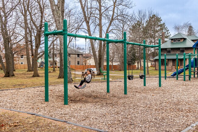 Kids enjoy the swings at Blackmer Park.