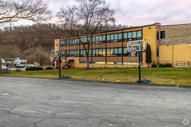 Young Scholars of Greater Allegheny Charter School shoot hoops for recess.