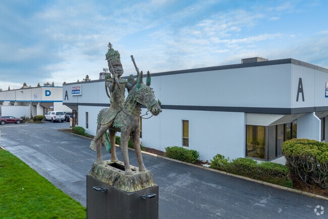 A welcoming statue marks the entrance to the Clackamas Business Center.