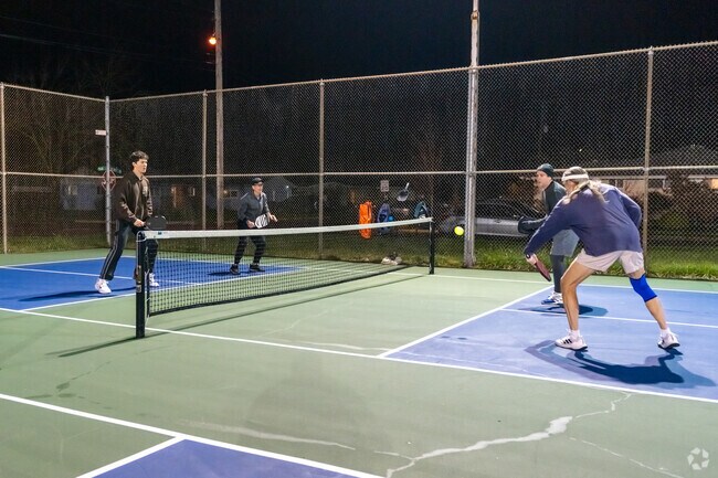 Players compete at the Westmoreland Pickleball Courts well into the night.