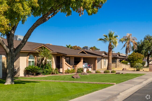 Well manicured lawns on these older Ranch homes show a sense of pride in Central Ridge.