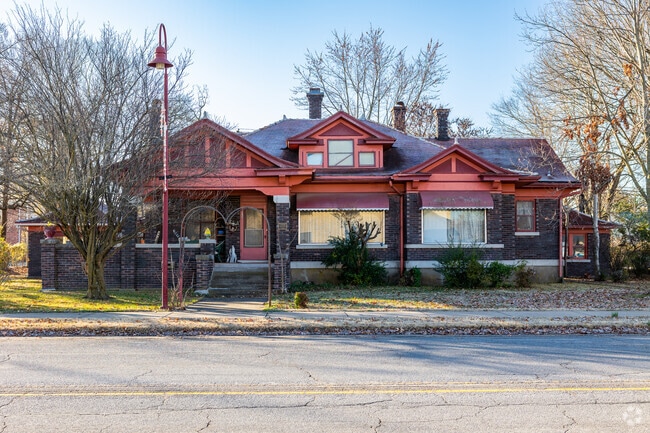 An large craftsman style home sit prominently near downtown Gentry.