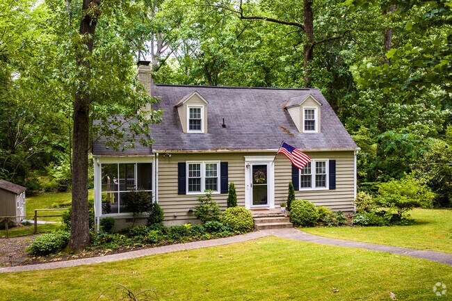 Cape Cod homes sit on tree lined streets in Southhampton, Richmond, VA.