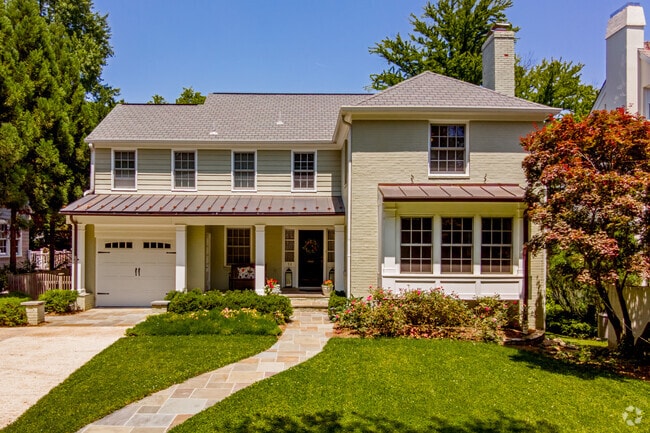 Lovely contemporary home in Chevy Chase Park boasts a large picture window and attached garage.