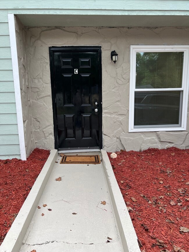 Front entrance with door bell and photo electric outside light