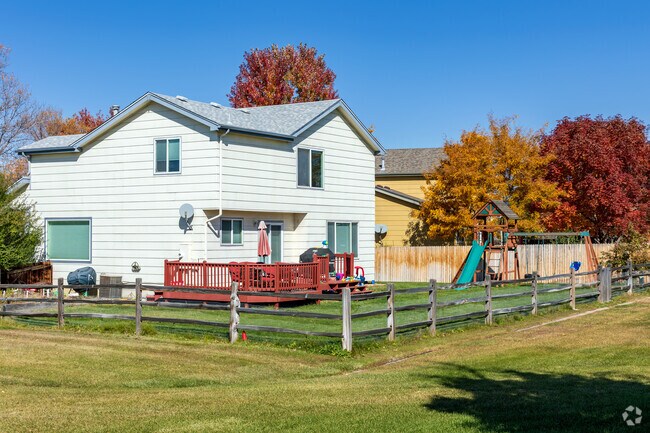 Grassy back yards allow for large decks and playground equipment in Willow Park.