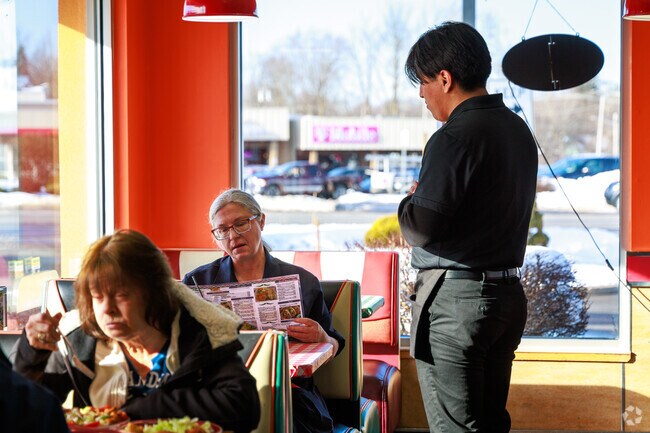 A woman orders her lunch at Cinco De Mayo II in Oneida.