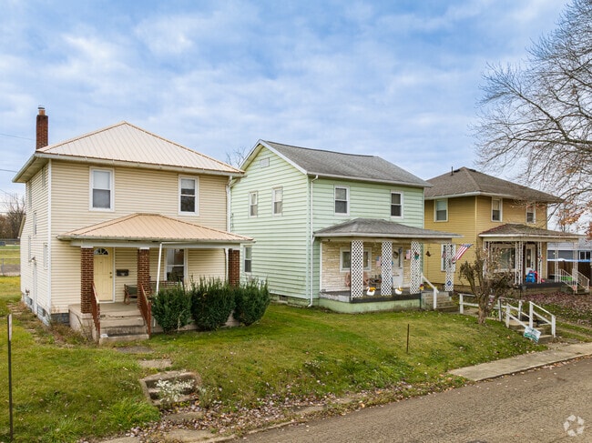 A row of early to mid 20th century homes with covered porches in West Park-Columbia.
