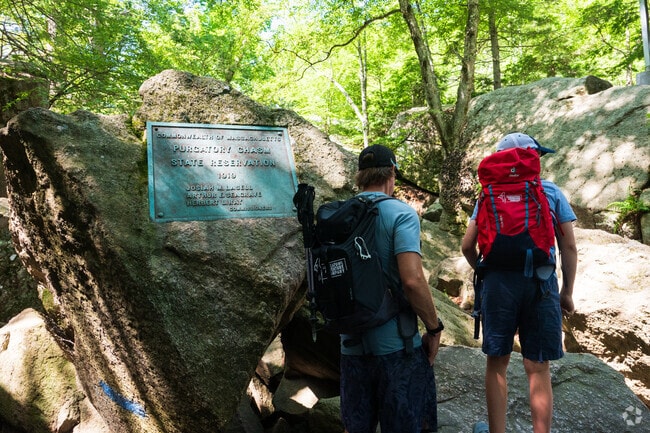 Purgatory Chasm’s towering cliffs and rocky trails make it a thrilling destination for hikers and nature lovers in the Sutton area.