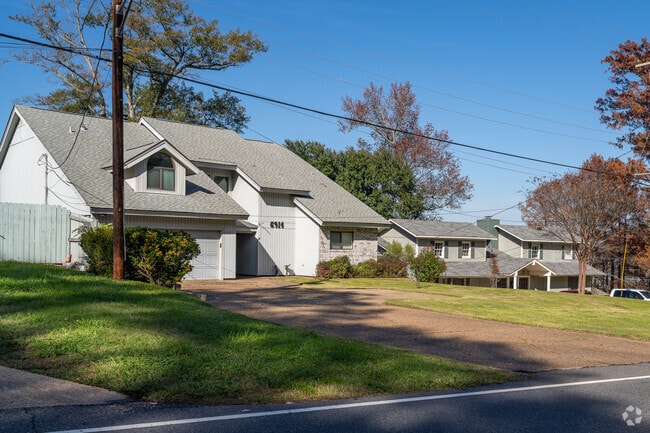 Traditional homes sit below mature trees in Western Hills-Yarborough.