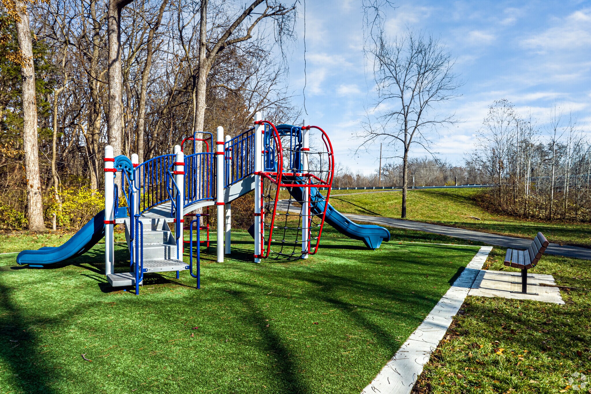 In Creekside Park locals can enjoy the paved trail through the woods that leads to a playground.