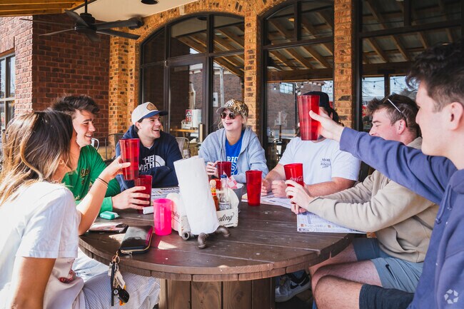 Roots Burger Bar patio is popular with Westwood Historic District students.