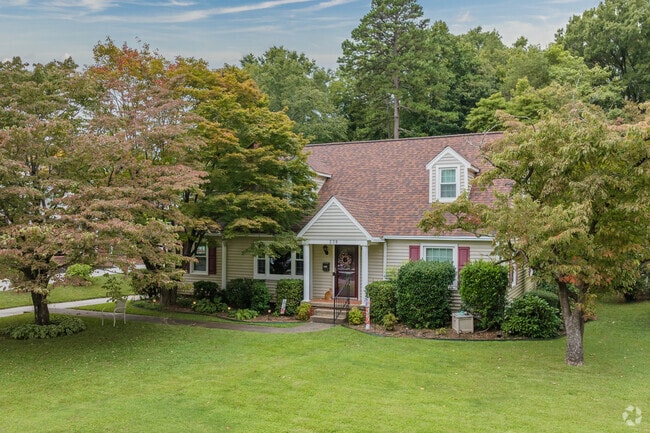 Amidst the trees, find a Craftsman-styled home in West Highlands.