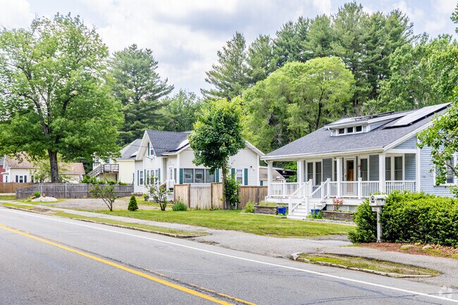 A row of ranch-style homes lines Littleton Road in Chelmsford, MA.