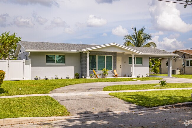 Brick ramblers with carports are common on the residential streets of Margate Gardens.