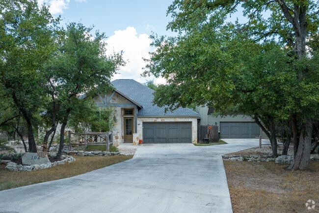 Single-story Wimberley Hills home with a bonus garage apartment for added versatility.