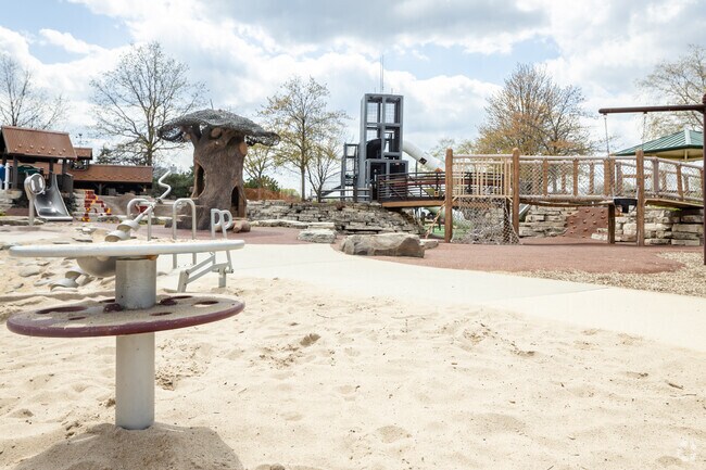 Playground With Unique Features Such as Willis Tower Model Located in Harvester Park.