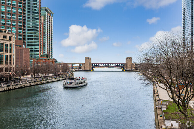 Tourists and locals can enjoy a ferry ride down the Chicago River in the New East Side.