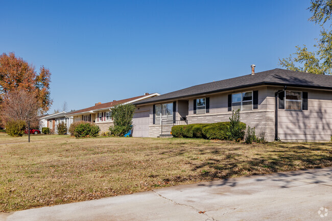 Ranch homes line a residential street in the Rosedale neighborhood.