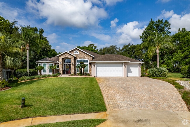 Brick front ranch-style homes are located along the streets of Debary Plantation.