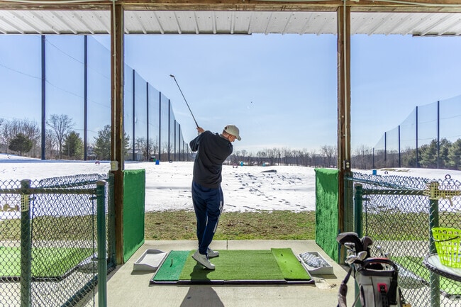 Four Seasons Golf offers year-round driving range practice near New Britain.