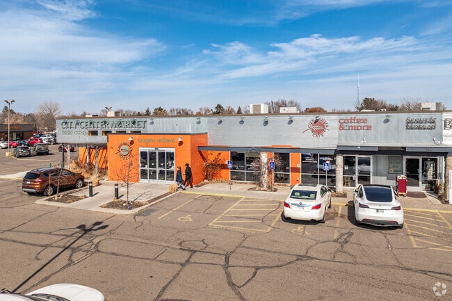 A resident shops for groceries at City Center Market in Cambridge.