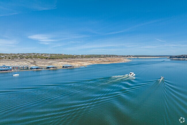 Navigate the pristine waters of Lake Travis in Lakeway, as you embark on a boating adventure.