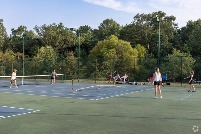 The tennis courts also have pickleball nets and markings in Wildewood.