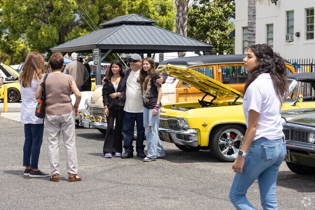 Pomona Catholic Car Show draws generations of local car enthusiasts.