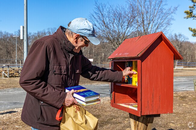Woodlot Park near Dayton hosts community events, summer concerts, and features a Little Library for book lovers.