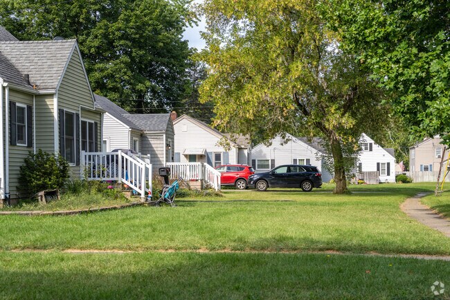 A row of traditional-style homes lines a quiet street in Burke Acres.