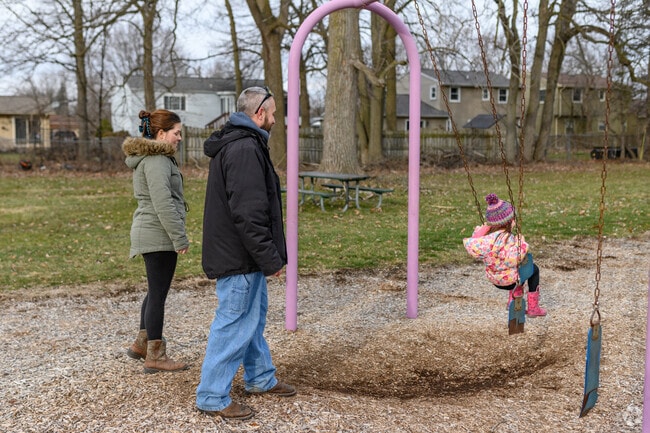 A family enjoys their time at Averill Park in Averill Woods, Lansing.