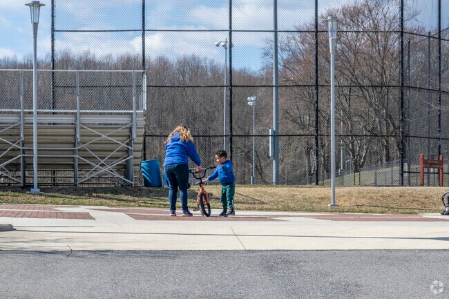 A kid learning to ride at Whitemarsh Park in next to Idlewild.
