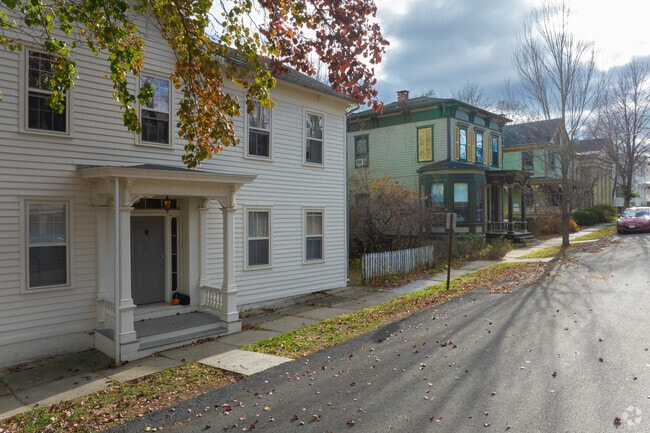 A row of older homes lines a street near Athens Riverfront Park.