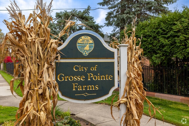 The city of Grosse Pointe Farms is a rustic suburb of Detroit full of tall trees and brick homes.