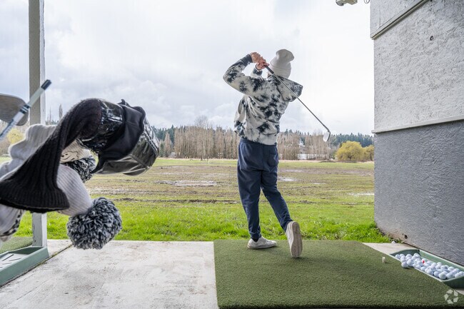 Work on your swing at the driving range in Woodinville near High Bridge.