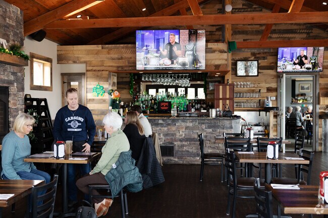 The interior of Carson's Woodside Tavern in Malta features spacious seating and rustic charm.