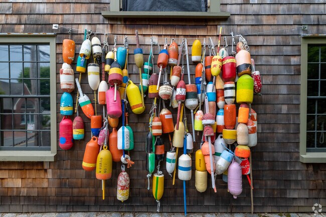Buoys on display in Cohasset Village reflect the town’s vibrant coastal character.