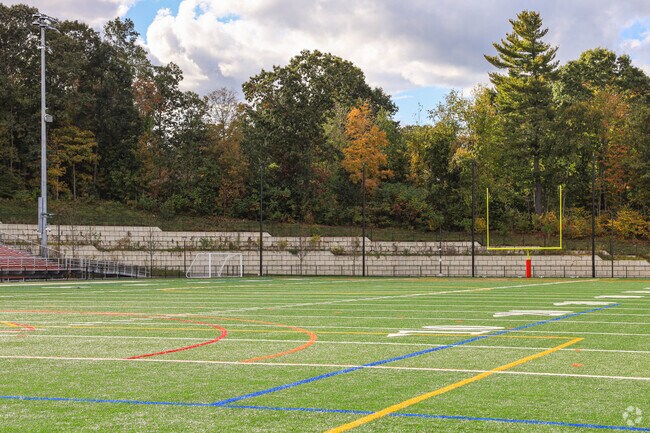 The football field at South High Community School in Worcester is green and spirited.