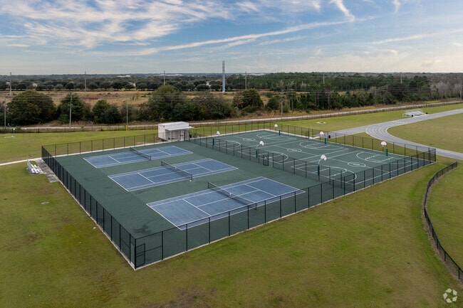 Children at Innovation Middle School relish PE, engaging in tennis and basketball.