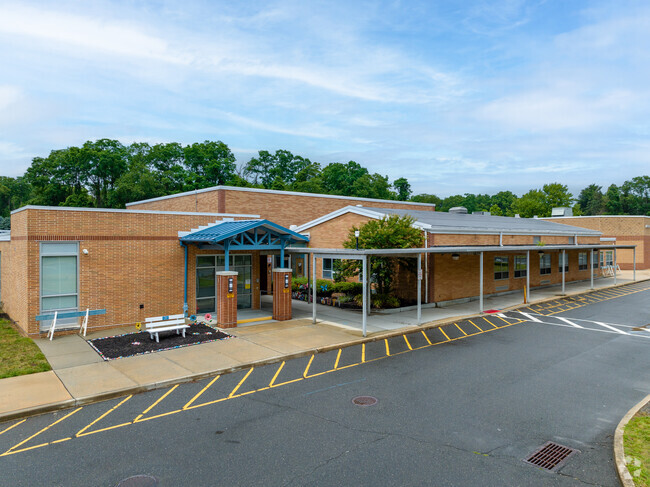 Student drop off at Asher Holmes Elementary School.