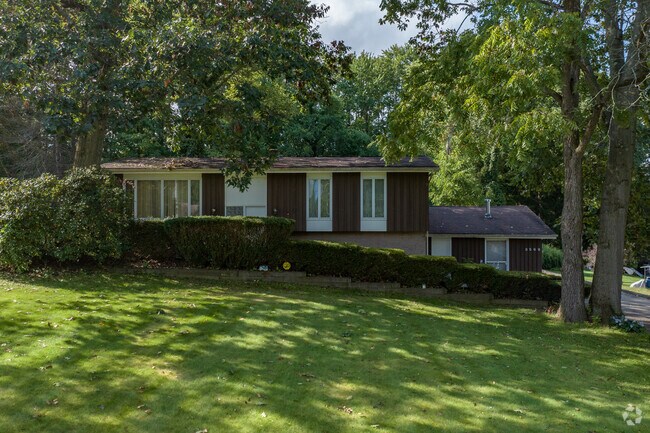 Many lots in Copley are split-level homes featuring towering trees and wide front lawns.