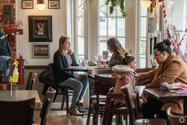 West End friends gather at Rachel's for coffee, crepes, and good conversation.