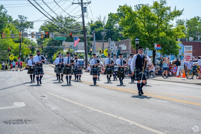 Bagpipers walking down Ethan Allen Blvd during the Takoma Park Fourth of July Parade.