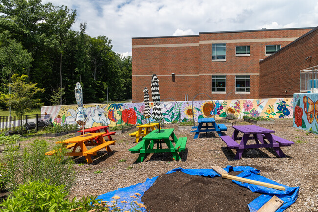 Uwchlan Hills Elementary School has colorful picnic tables in their garden.