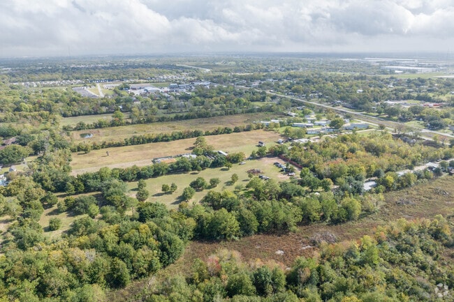 Large plots of land are commonly found adjacent to neighborhoods in Highlands, Texas.