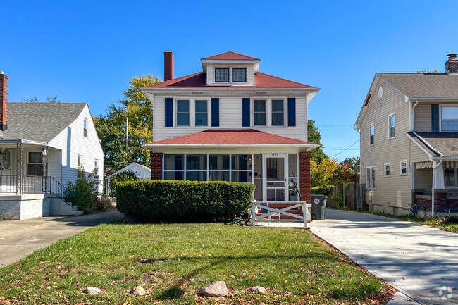 A bright red roof greets you to this charming home in Hearthstone.