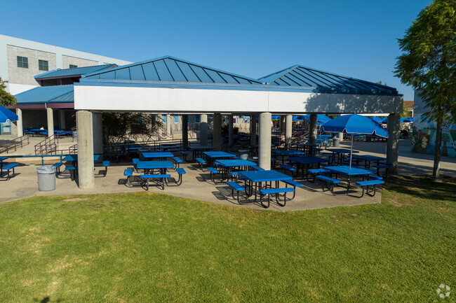 Lots of dining tables for outdoor seating during lunch time.